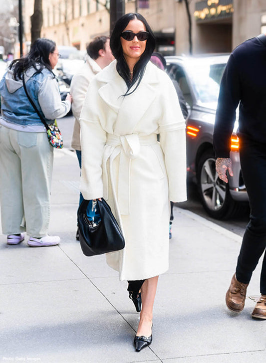 American singer, songwriter and television personality Katy Perry is wearing the SENTALER Men Technical Bouclé Alpaca Robe Coat in Ivory White walking in the streets of New York.