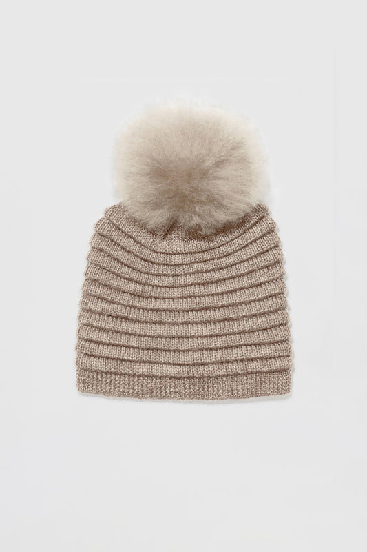 Sentaler Adult Ribbed Hat With Oversized Fur Pompon featured in Baby Alpaca and available in Light Taupe Neutral. Seen as off figure.