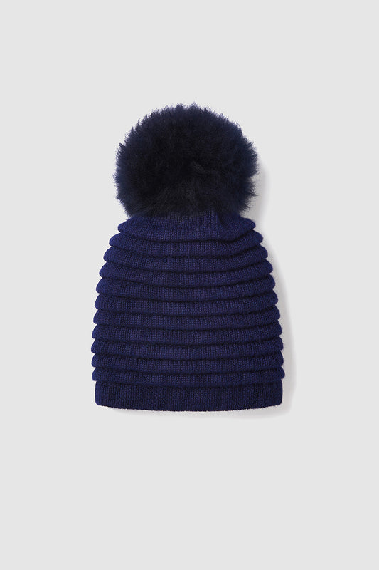 Sentaler Adult Ribbed Hat With Oversized Fur Pompon crafted in Baby Alpaca and in Navy Blue. Seen off figure.