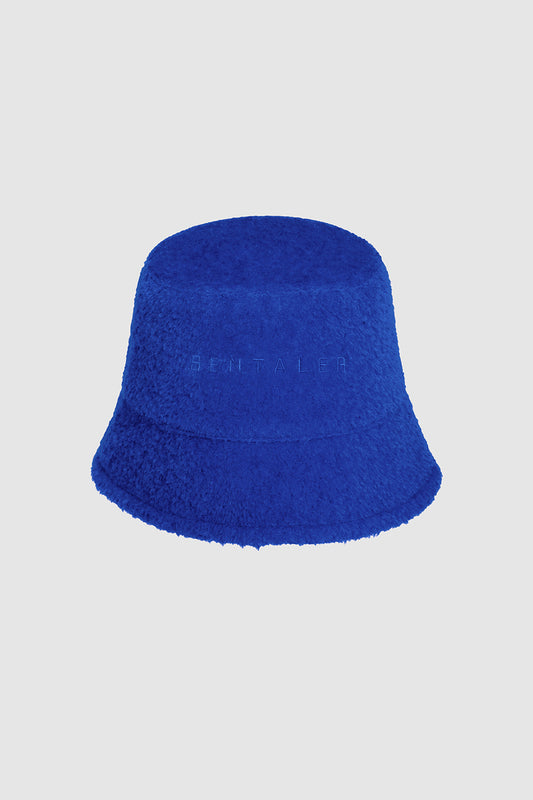 Sentaler Bouclé Alpaca Bucket Hat featured in Bouclé Alpaca and available in Cobalt Blue. Seen as off figure.