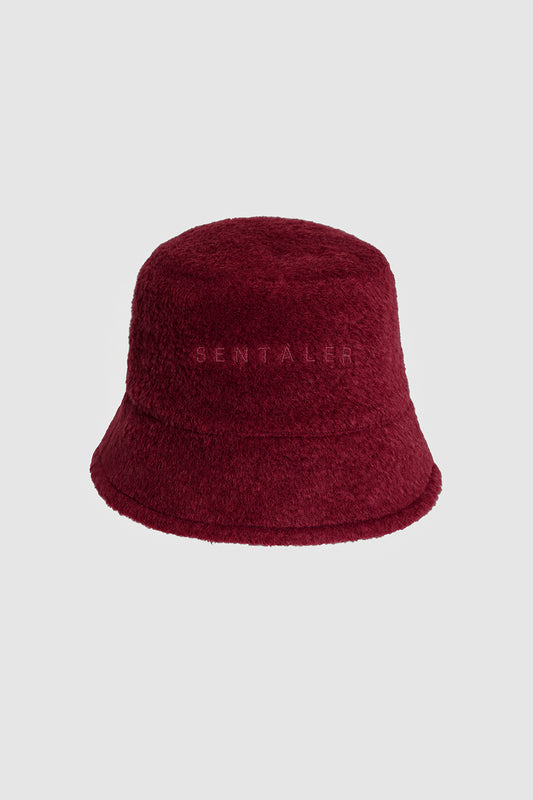 Sentaler Bouclé Alpaca Bucket Hat featured in Bouclé Alpaca and available in Garnet Red. Seen as off figure.