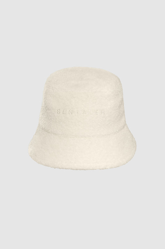 Sentaler Bouclé Alpaca Bucket Hat featured in Bouclé Alpaca and available in Ivory White. Seen as off figure.