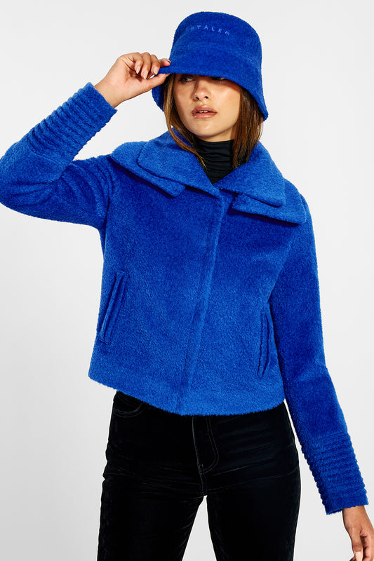 Sentaler Bouclé Alpaca Bucket Hat and Bouclé Alpaca Moto Jacket with Signature Double Collar featured in Bouclé Alpaca and available in Cobalt Blue. Seen from front on female model.
