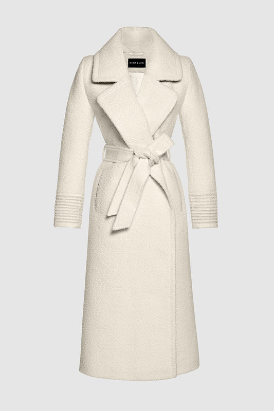 Sentaler Bouclé Alpaca Long Notched Collar Wrap Coat featured in Bouclé Alpaca and available in Ivory White. Seen as off figure belted.