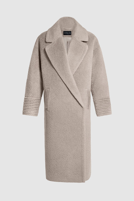 Sentaler Bouclé Alpaca Long Oversized Notched Collar Coat featured in Bouclé Alpaca and available in Sand Neutral. Seen as off figure.