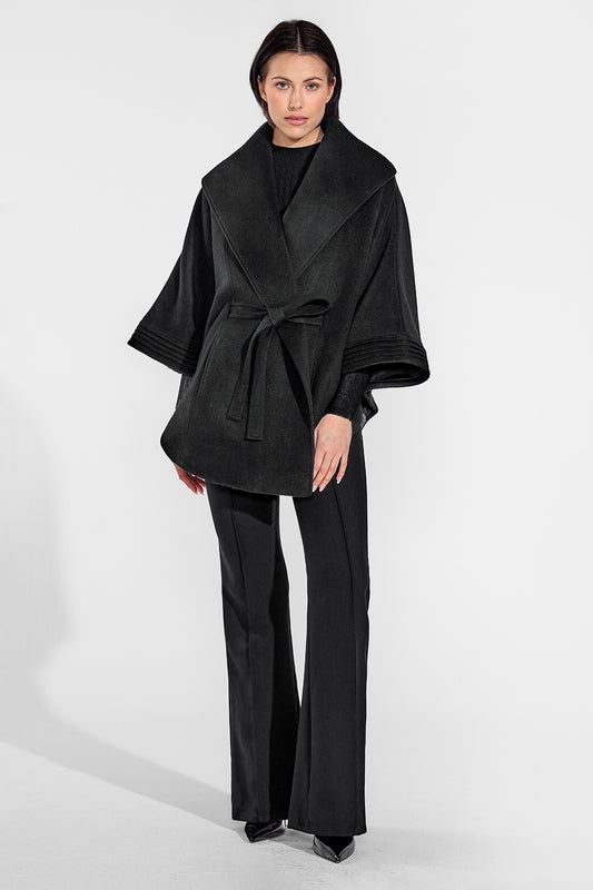 Sentaler Cape with Shawl Collar and Belt featured in Baby Alpaca and available in Black. Seen from front on female model who is wearing the cape belted.