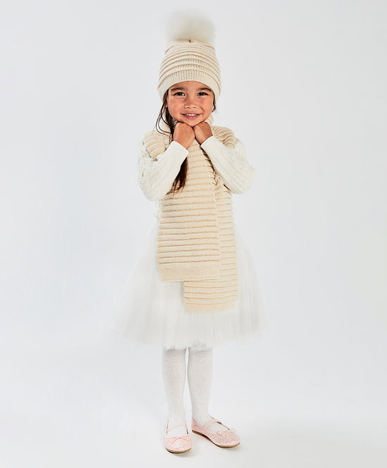 Sentaler Kids (1-5 Years) Ribbed Scarf featured in Baby Alpaca and available in Ivory. Seen from front on model.