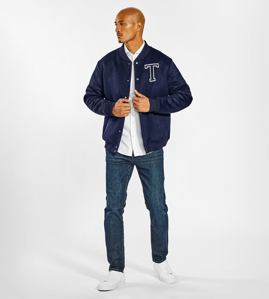 Sentaler SENTALER x John Tavares Varsity Jacket crafted in Technical Baby Alpaca and available in Deep Navy. Seen from front open on male model.