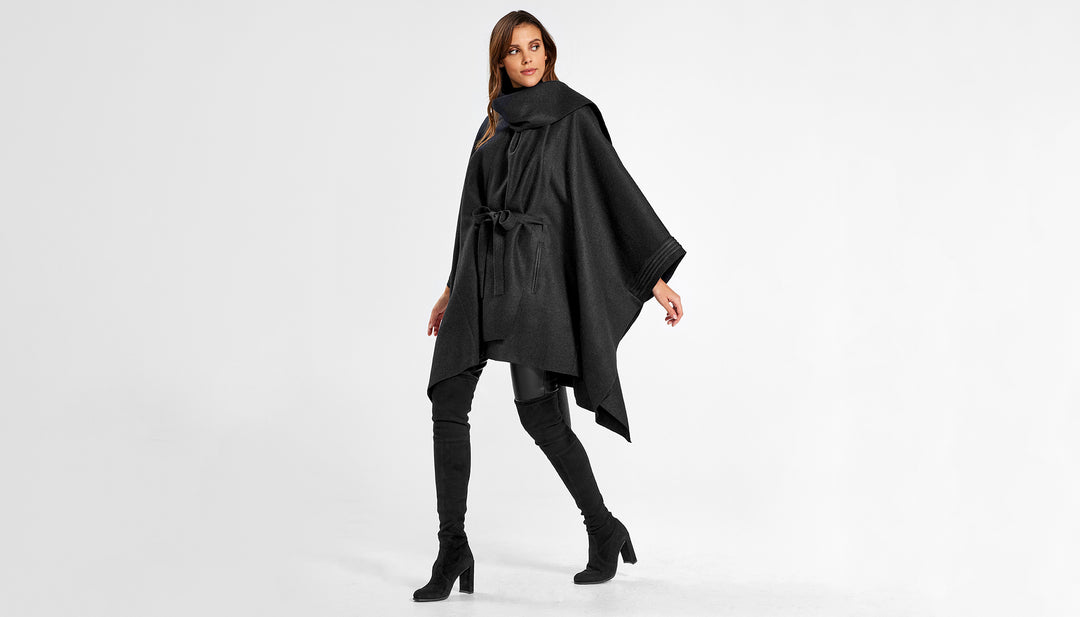 Sentaler Poncho with Shawl Collar and Belt featured in Superfine Alpaca and available in Black. Seen from side on female model who is wearing the poncho belted.