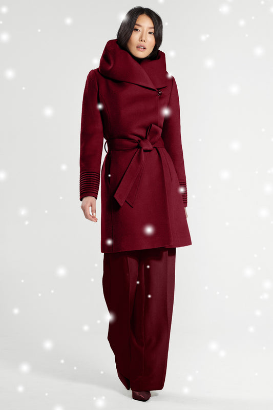 Sentaler Mid Length Hooded Wrap Coat featured in Baby Alpaca and available in Garnet Red. Seen from front with snow effect.