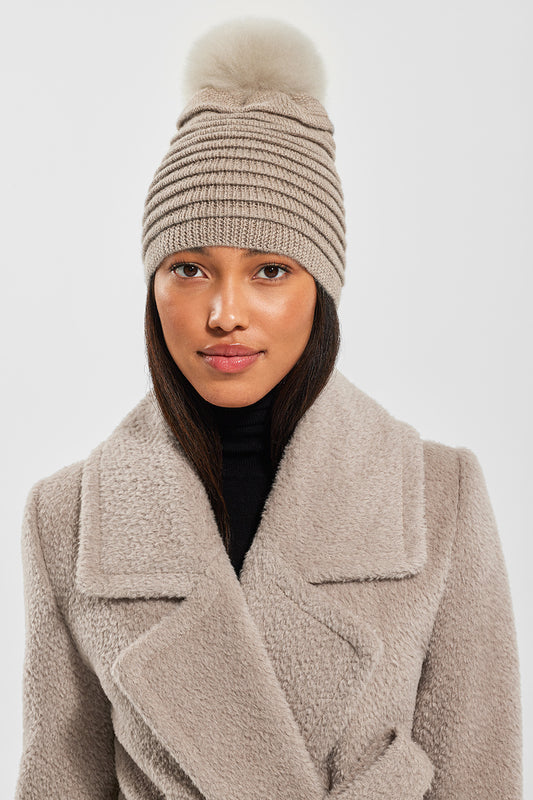 Sentaler Adult Ribbed Hat With Oversized Fur Pompon featured in Baby Alpaca and available in Light Taupe. Seen from front 1.