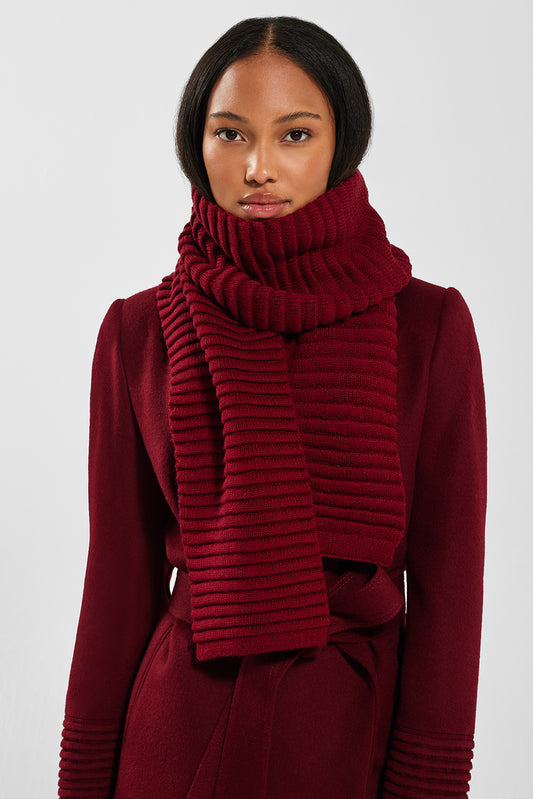 Sentaler Adult Ribbed Scarf featured in Baby Alpaca and available in Garnet Red. Seen from front on model above the knee.