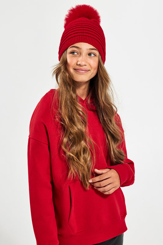 Sentaler Kids (6-14 Years) Ribbed Hat with Oversized Fur Pompon featured in Baby Alpaca and available in Red. Seen from front.